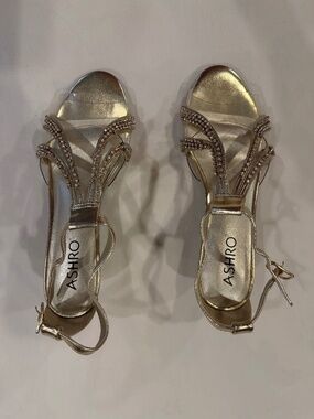 Gold and clear evening shoes with low heel